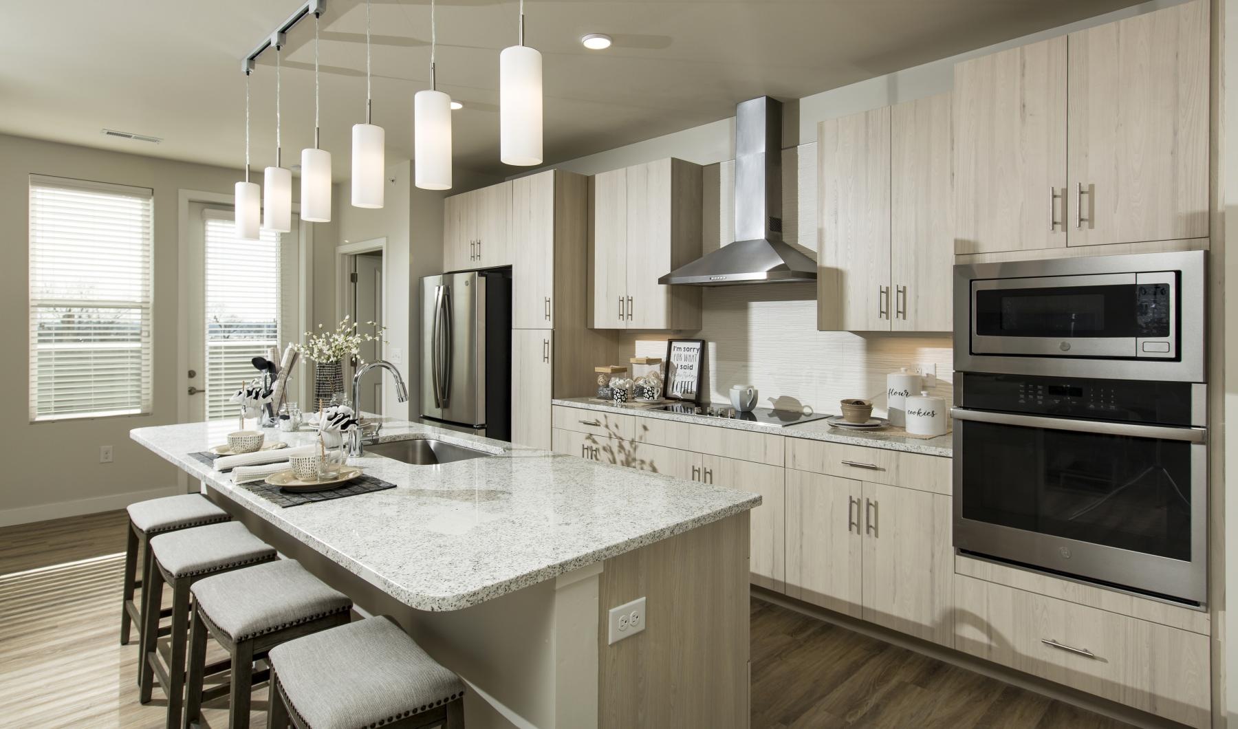 a kitchen with white cabinets