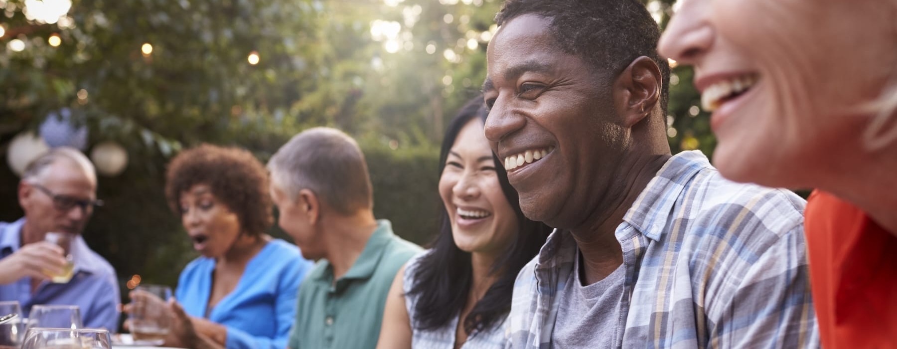people outdoors smiling