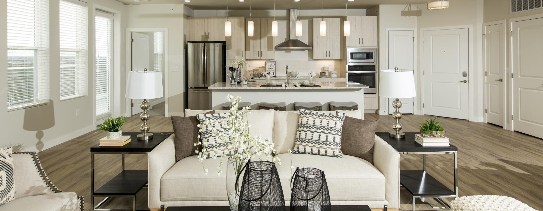 a living room with a large kitchen